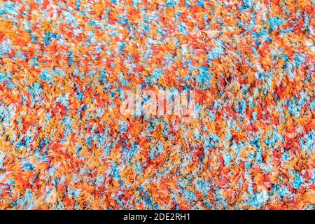 Mehrfarbige Textur aus Wolle Teppich Hintergrund. Fragment farbige Teppiche, helle Weide bunten Teppich Stockfoto