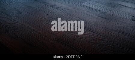 Dunkelbrauner Holzhintergrund. Stockfoto