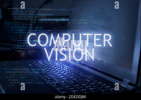 Computer Vision Inschrift gegen Laptop und Code-Hintergrund. Technologiekonzept Stockfoto