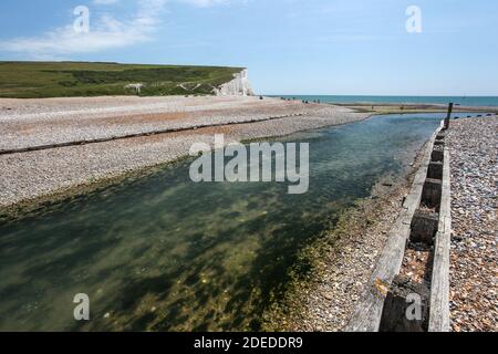 Sussex's einzige unerschlossenen Flussmündung enthält die faszinierendsten Landschaften der Südküste, geschützt durch die NT, Country Park und SSSI Systeme. Stockfoto