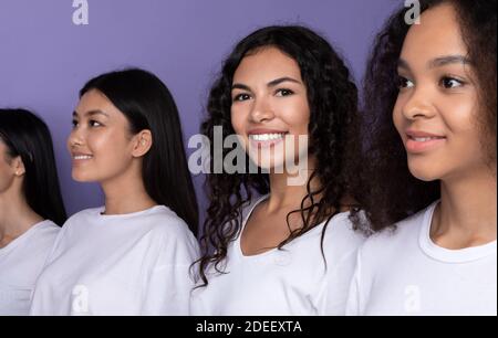 Latin Woman Standing In Row With Multiracial Ladies, Studio Shot Stockfoto