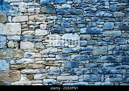 Alte steinerne Wand Textur mit Blue Denim. Stockfoto