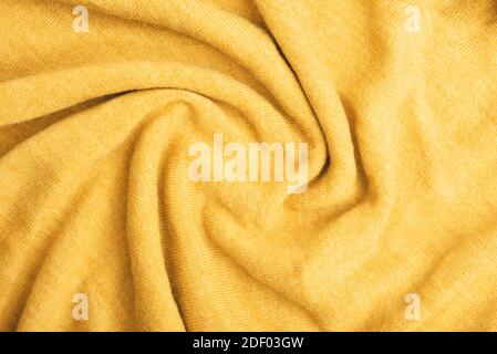 Nahaufnahme von gelben gestrickten strukturierten Hintergrund. Trendige Farben. Stockfoto