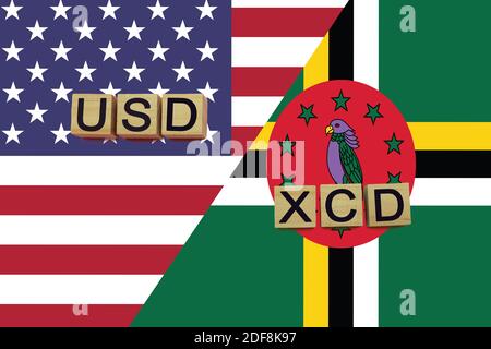 USA und Dominica Währungen Codes auf nationalen Flaggen Hintergrund. Internationales Geldtransferkonzept Stockfoto