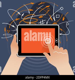 Ein flacher Tablet-PC – Halten Sie ihn gedrückt, während Sie den Bildschirm mit dem rechten Zeigefinger vor einem Hintergrund mit zufällig gezeichneten Linien und Pfeilen berühren. Stockfoto