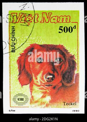 MOSKAU, RUSSLAND - 10. NOVEMBER 2018: Eine in Vietnam gedruckte Briefmarke zeigt, Internationale Briefmarkenausstellung Neuseeland '90 (Hunde) Serie, um 1990 Stockfoto