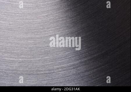 Makroansicht der gebürsteten grauen Metalloberfläche Stockfoto