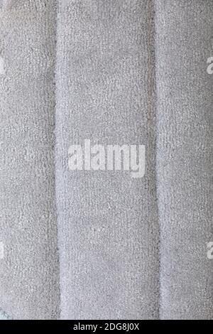 Struktur aus grauem Frottee. Grau flauschigen Hintergrund des Fadens. Handtuch Stoff Struktur closeup Foto Stockfoto