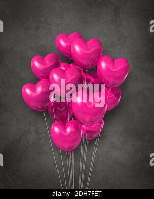 Rosa Herz Form Luftballons Gruppe auf einem konkreten Hintergrund Stockfoto