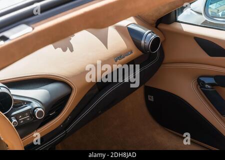 Close up detail of the leather interior and dashboard of a white Ferrari F8 Spider convertible sports car Stock Photo