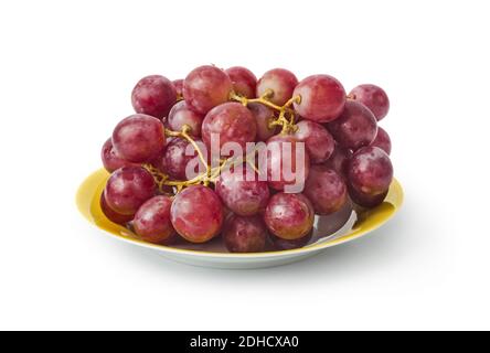Reife Trauben auf gelbem Teller Stockfoto