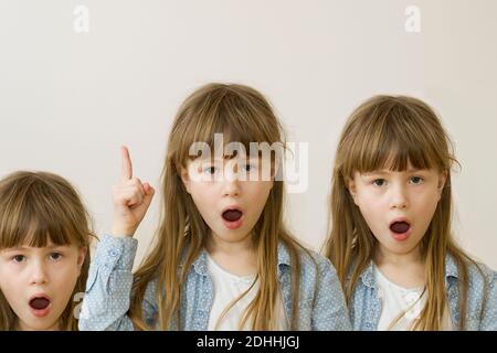 Collage von drei hübschen Mädchen mit langen lockeren Haaren, erhobenem Finger und lustigen Gesichtsausdruck auf hellem Hintergrund. Stockfoto