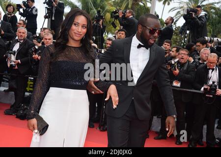 Maitre Gims und seine Freundin waren am 14. Mai 2016 im Palais des Festivals in Cannes, Frankreich, bei der Vorführung der BFG im Rahmen der 69. Filmfestspiele von Cannes. Foto von Lionel Hahn/ABACAPRESS.COM Stockfoto