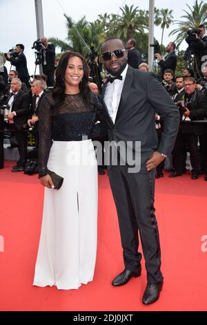 Maitre Gims und seine Freundin waren am 14. Mai 2016 im Palais des Festivals in Cannes, Frankreich, bei der Vorführung der BFG im Rahmen der 69. Filmfestspiele von Cannes. Foto von Lionel Hahn/ABACAPRESS.COM Stockfoto