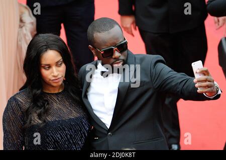 Maitre Gims und seine Freundin waren am 14. Mai 2016 im Rahmen der 69. Filmfestspiele von Cannes bei der "BFG"-Vorführung im Palais des Festivals in Cannes, Frankreich, dabei. Foto von Aurore Marechal/ABACAPRESS.COM Stockfoto