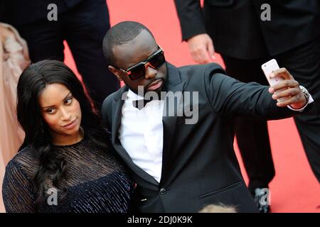 Maitre Gims und seine Freundin waren am 14. Mai 2016 im Rahmen der 69. Filmfestspiele von Cannes bei der "BFG"-Vorführung im Palais des Festivals in Cannes, Frankreich, dabei. Foto von Aurore Marechal/ABACAPRESS.COM Stockfoto