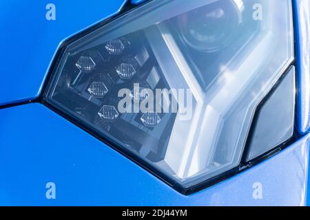 Close up detail of the front left headlight of a blu le mans Lamborghini Aventador S LP740-4 Stock Photo