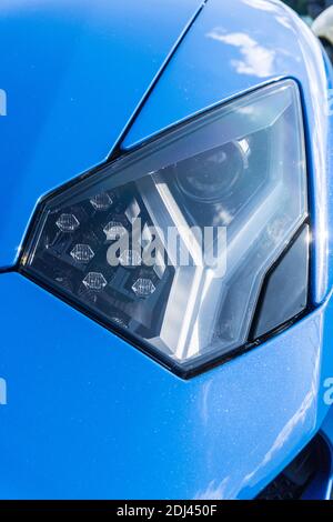 Close up detail of the front left headlight of a blu le mans Lamborghini Aventador S LP740-4 Stock Photo