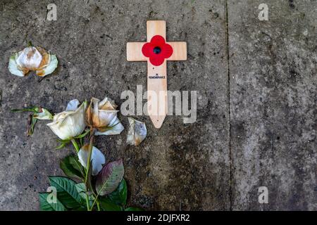 London/UK. 12.2.20. Remembrance day poppies left next to the war memorial in the atmospheric western part of Highgate Cemetery in north London Stock Photo