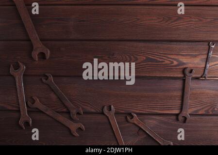 Old Rusty Tools on the Grunge Wooden Background Stock Photo