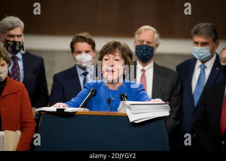 United States Senator Susan Collins (Republican of Maine) offers remarks while joined by United States Senator Joe Manchin III (Democrat of West Virginia) and a bipartisan group of US Senators announcing the legislative text of the two bipartisan, bicameral COVID-19 emergency relief bills that propose to provide up to $908 billion in emergency relief in the Dirksen Senate Office Building on Capitol Hill in Washington, DC on Monday, December 14, 2020.Credit: Rod Lamkey/CNP | usage worldwide Stock Photo