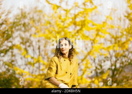 woman resting in the park during autumn II Stock Photo