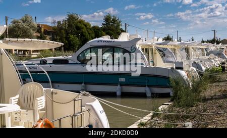 Mooring for houseboats on the Canal du Midi in Le Somail in summer. Stock Photo