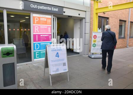 Outpatients entrance, Norfolk & Norwich Universities Hospital NHS Trust with Covid-19 warning signs, Norwich UK December 2020 Stock Photo