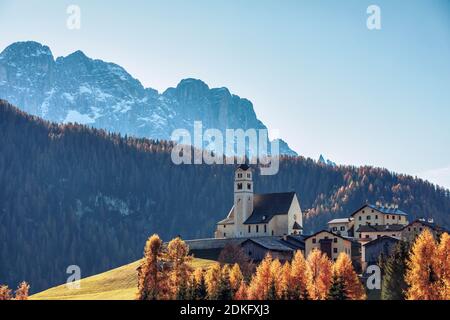 the village of Colle Santa Lucia with the church on the hill in autumn, belluno Province, Dolomites, Veneto, Italy Stock Photo