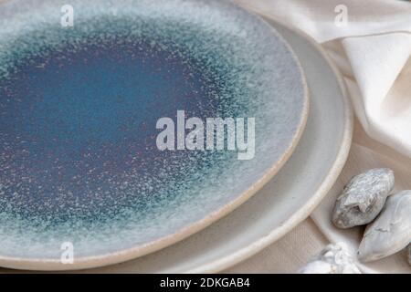 Detailed of Ceramic Plates on Calico. Ceramic tableware, Beautiful arrangement. Stock Photo