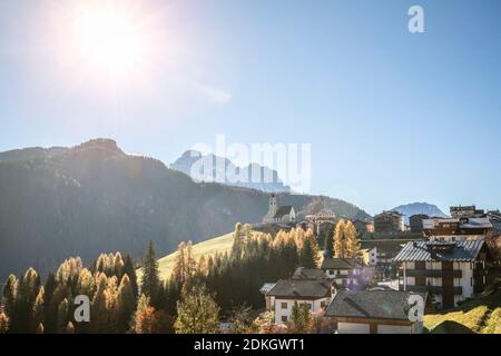 the village of Colle Santa Lucia with the church on the hill in autumn, belluno Province, Dolomites, Veneto, Italy Stock Photo