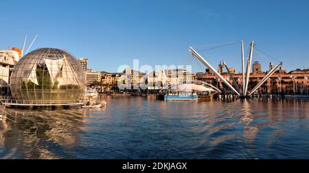 aquarium, bubble (renzo piano biosphere) and panorama of the port and the city skyscrapers December 13 2020 Genoa Italy Stock Photo