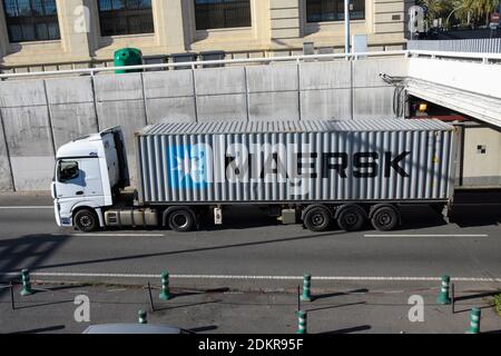 White truck with Maersk container in a dual carriageway. Stock Photo