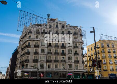 Madrid, Spain - November 22, 2020: Gran via Avenue with Christmas decoration a sunny day with bright blue sky Stockfoto