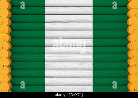 Nationalflagge von Nigeria auf einem hölzernen Wandhintergrund. Das Konzept des Nationalstolzes und ein Symbol des Landes. Flaggen auf einem Haus gemalt Stockfoto