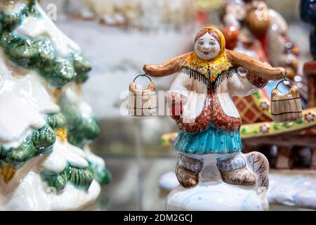 Ceramic figurine of a village woman in traditional Russian clothes Stock Photo