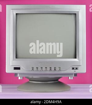 Retro TV from 80s close-up on a pink background. Stock Photo