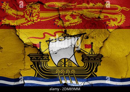 Flagge von New Brunswick auf rissige Wand gemalt Stockfoto