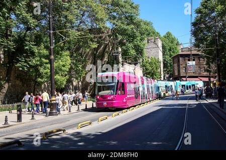 ISTANBUL - MAY 18, 2014 - Colorful tram rapid transit heads down to the Golden Horn  in Istanbul, Turkey Stockfoto