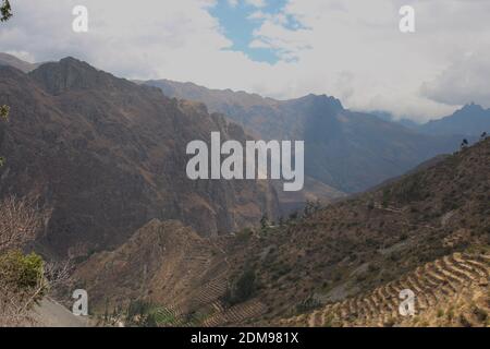 Farming terraces down the side of the Patacancha Mountain in the Andes Mountains in Peru, South America Stock Photo