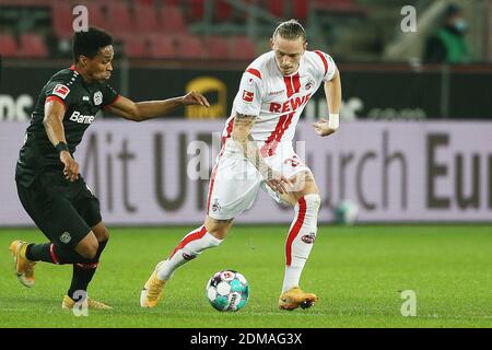 Köln. Dezember 2020. Wendell (L) aus Leverkusen steht mit Marius Wolf aus Köln während eines Bundesliga-Fußballspiels zwischen dem FC Köln und Bayer 04 Leverkusen in Köln am 16. Dezember 2020. Quelle: Xinhua/Alamy Live News Stockfoto