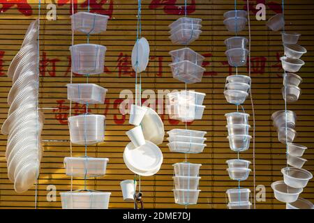 January 10, 2020 -  Alor Setar, Kedah, Malaysia: An arrangement of hanging plastic containers in a store located in Alor Setar, Kedah, Malaysia. Stock Photo