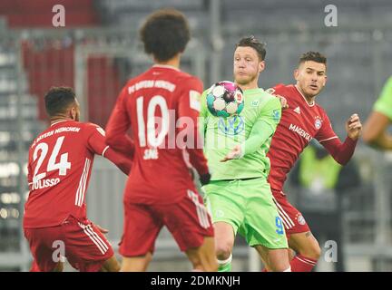 Munich, Germany. 16th Dec, 2020. Wout WEGHORST, WOB 9  compete for the ball, tackling, duel, header, zweikampf, action, fight against Lucas HERNANDEZ (FCB 21) Corentin TOLISSO, FCB 24  in the match FC BAYERN MUENCHEN - VFL WOLFSBURG 2-1 1.German Football League on December 16, 2020 in Munich, Germany.  Season 2020/2021, matchday 12, 1. Credit: Peter Schatz/Alamy Live News Stock Photo