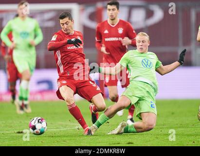 Munich, Germany. 16th Dec, 2020. Robert LEWANDOWSKI, FCB 9  compete for the ball, tackling, duel, header, zweikampf, action, fight against Xaver SCHLAGER, WOB 24  in the match FC BAYERN MUENCHEN - VFL WOLFSBURG 1.German Football League on December 16, 2020 in Munich, Germany.  Season 2020/2021, matchday 12, 1. Credit: Peter Schatz/Alamy Live News Stock Photo