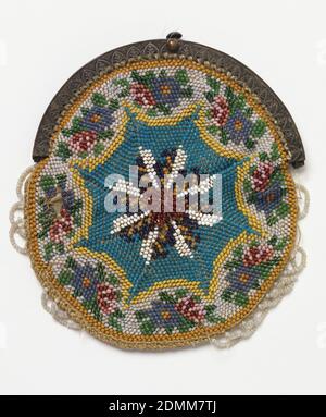 Purse, Medium: glass beads, silk, metal frame Technique: beaded knitting, Knitted bag, circular in form, with an eight-pointed star in the middle with a floral border. Beaded scallops around edges; metal frame, silk lining., USA, mid-19th century, costume & accessories, Purse Stock Photo