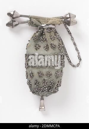 Purse, Medium: silk, metal Technique: beaded crochet, Fine grey silk crocheted net with cut steel beads; steel bars, ring, and chain at top. Pendant ornament of cut steel at bottom., France, early 19th century, costume & accessories, Purse Stock Photo