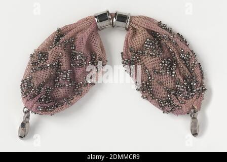 Miser's purse, Medium: silk, metal Technique: crocheted, Crocheted mauve silk ornamented with cut steel beads in geometric pattern. Two round steel rings control the side opening. Small steel drops at each end., France, early 19th century, costume & accessories, Miser's purse Stock Photo