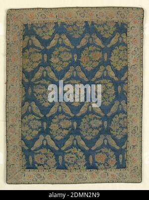 Textile, Medium: silk Technique: brocaded on satin weave, Central field has a repeating pattern of paired confronting birds alternating with floral paisley botehs on a blue ground. Attached border has an off-white ground with pink and green flowers, edged with a metallic cord., Abianeh (near Kashan), Iran, late 17th century, woven textiles, Textile Stock Photo