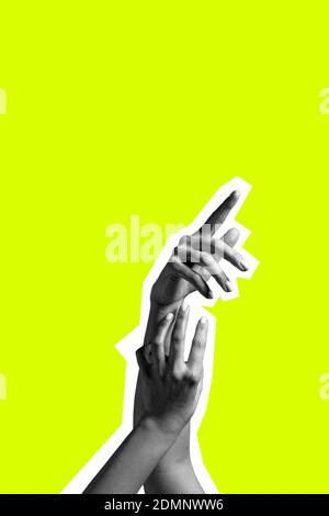 Contemporary art collage. Female or male hands isolated over yellow background. Stockfoto