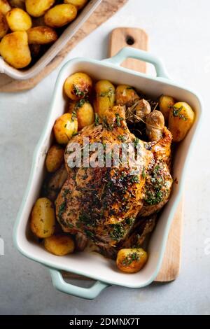 Roast chicken with potatoes ready to eat Stock Photo